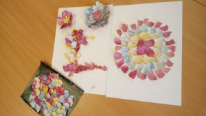 Flower shapes created from pieces of dyed egg shell